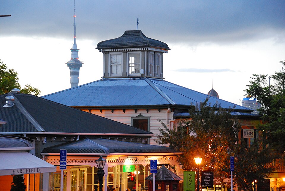 Historic Parnell village buildings with the Sky Tower beyond